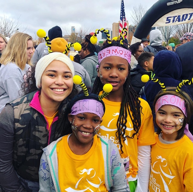 A photo of Jessica McKenzie and some of her participants at the Girls on the Run 5K after the Fall 2019 season.